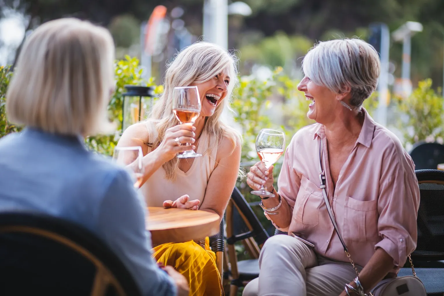 happy-senior-women-drinking-wine-